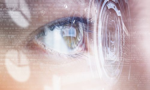 Close up of human eye on digital technology background